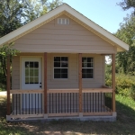 12x20 shed with 4' front porch with cedar posts and railing